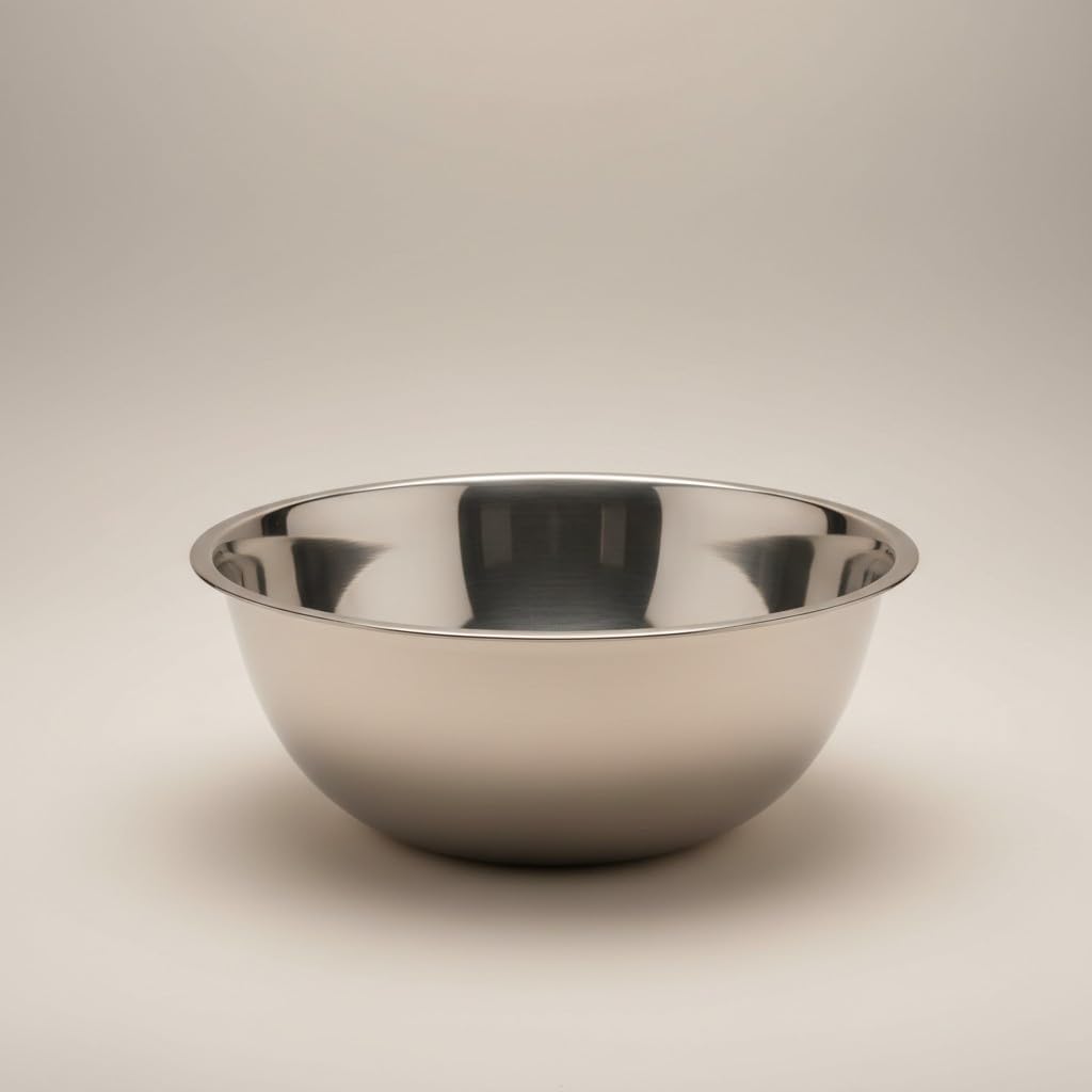 Empty stainless steel mixing bowl on a neutral countertop