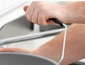 Close-up of a hand holding the bucket handle