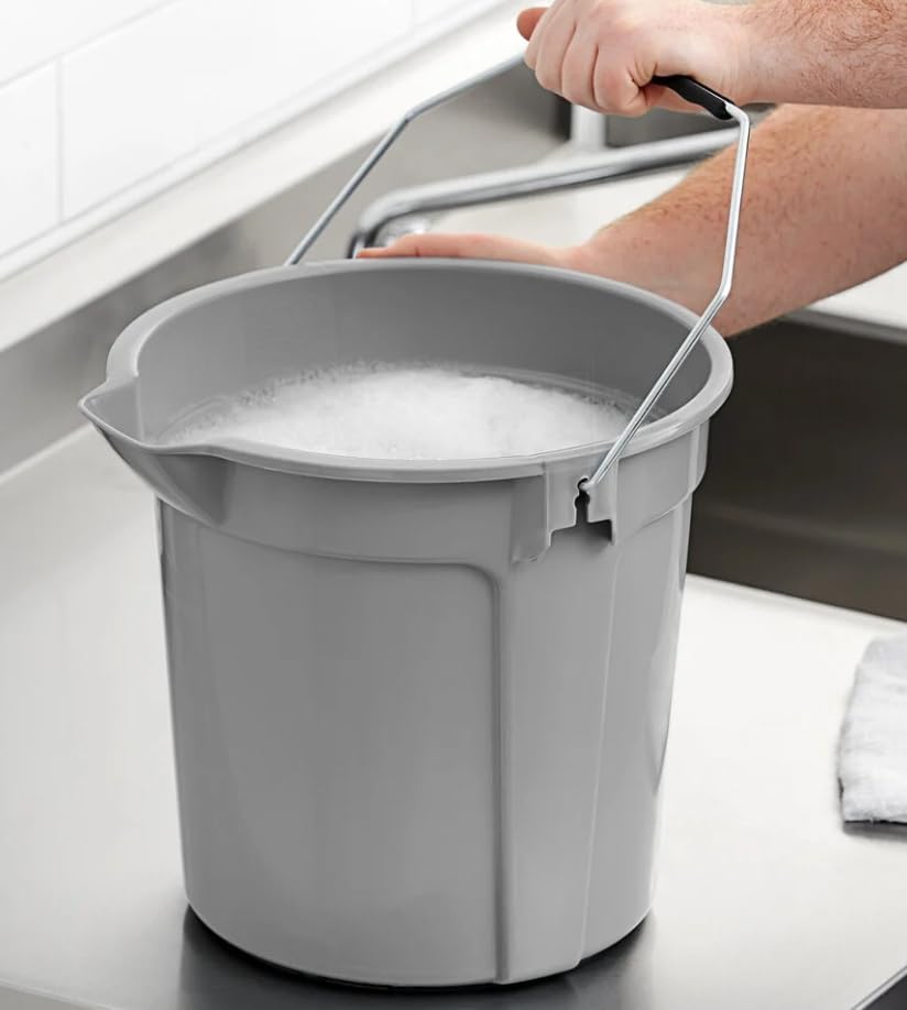 Water-filled gray bucket with its metal handle raised